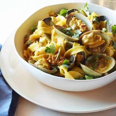 Fettuccine with Manila Clams, Spicy Sausage and White Wine Saffron Reduction