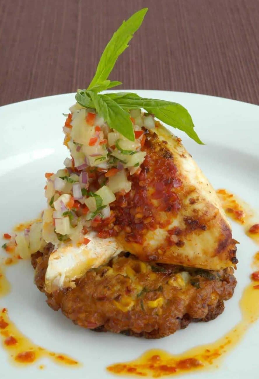 HARISSA MARINATED CHICKEN ON CORN AND CORIANDER FRITTERS WITH PINEAPPLE SALSA